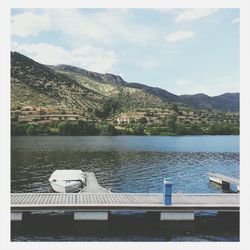 Scenic view of lake against cloudy sky