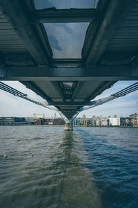 View of bridge over river in city