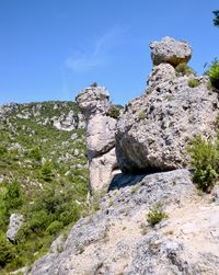 Rock formation on mountain against clear sky