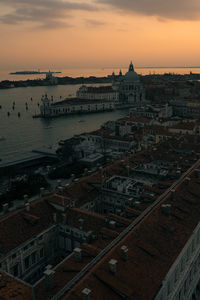 High angle view of buildings against sky during sunset