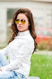 Portrait of young woman wearing sunglasses