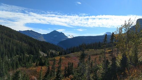 Scenic view of mountains against cloudy sky