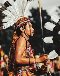 Side view of man wearing traditional clothing during festival