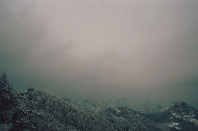 Scenic view of foggy landscape