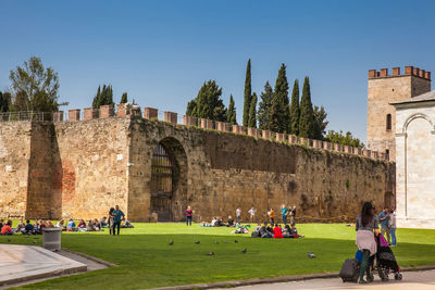 Gate of the lion and the saint mary tower at the ancient walls of pisa