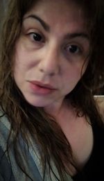 Close-up portrait of a smiling young woman