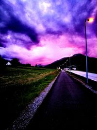 Road amidst trees against sky