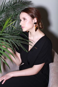 Midsection of woman holding christmas tree