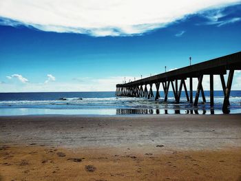 Pier over sea against sky