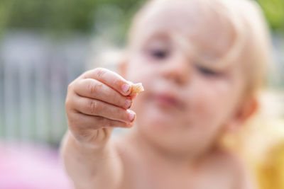 Close-up of cute girl eating food