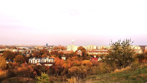 View of buildings in city against clear sky