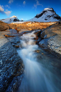 Scenic view of snow covered mountains