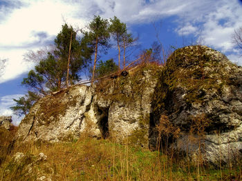 Low angle view of rocks against sky