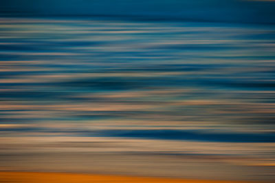 Scenic view of sea against sky at sunset