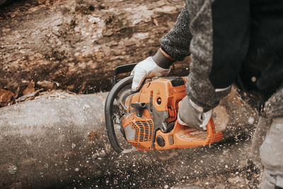 Low section of man working at workshop