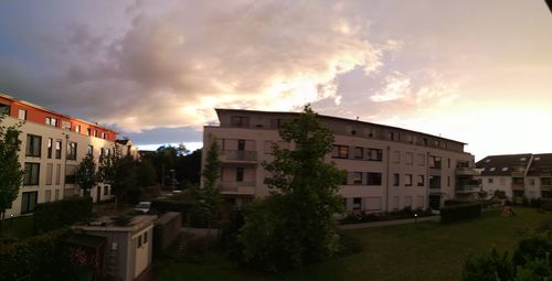 Buildings against sky during sunset