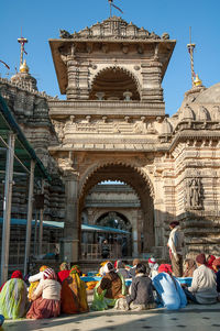 Group of people in front of historic building
