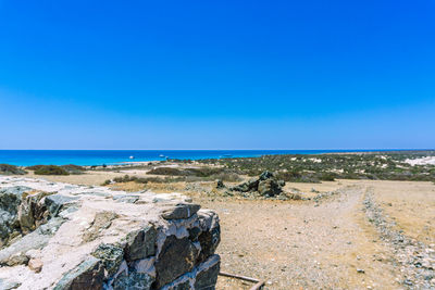 Scenic view of sea against clear blue sky