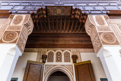 Low angle view of an engraved moroccan gate in bahia palace - marrakech, morocco