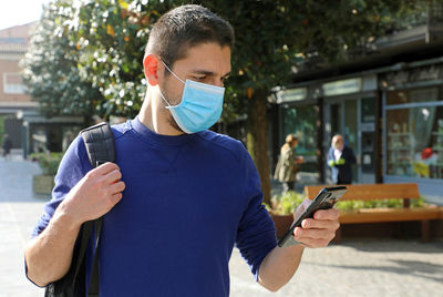 Young man using mobile phone