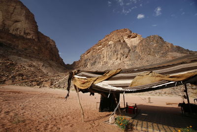 Tent in desert against sky