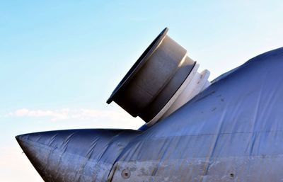 Low angle view of airplane against clear sky