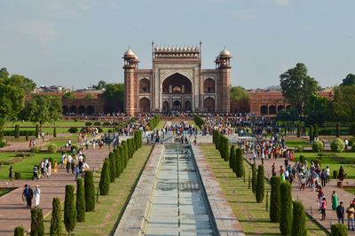 Group of people in front of entrance gate at taj mahal