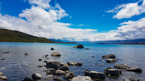 Panoramic view of sea against blue sky