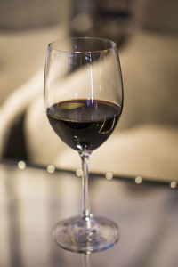 Close-up of wineglass on table