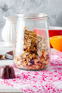 Close-up of ice cream in glass jar on table