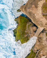 High angle view of rocks in sea