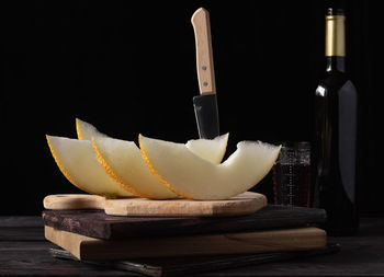 Close-up of drink on table against black background