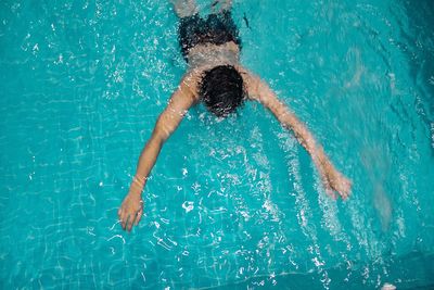 High angle view of man swimming in pool