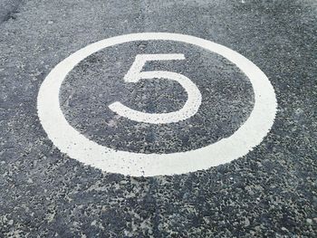 High angle view of road sign on street