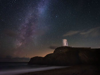 Scenic view of sea against sky at night