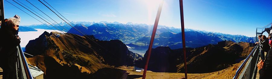 Scenic view of mountains against blue sky