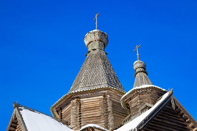 Low angle view of traditional building against blue sky