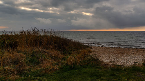 Scenic view of sea against sky during sunset