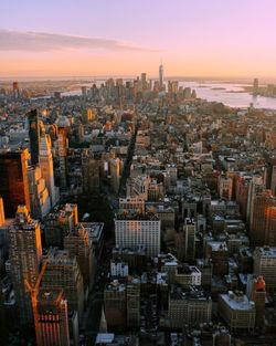 Aerial view of city buildings during sunset