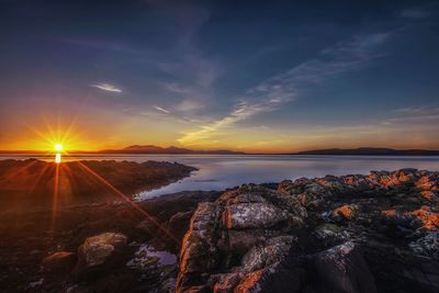 Scenic view of sea against sky at sunset