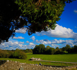 Countryside landscape against blue sky and clouds