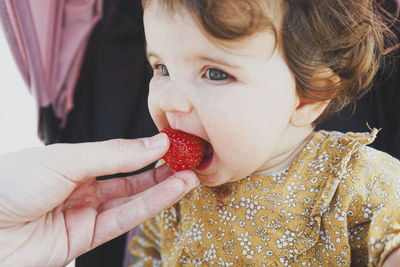 Close-up portrait of boy eating food