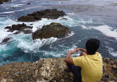 Sea waves splashing on rocks