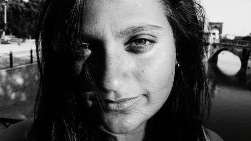 Close-up portrait of smiling young woman