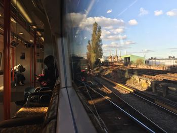 Train on railroad tracks against sky