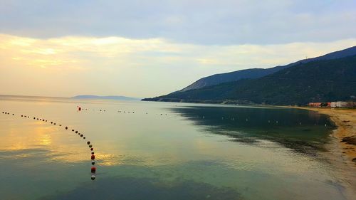 Scenic view of sea against sky at sunset