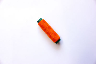 High angle view of cigarette against white background