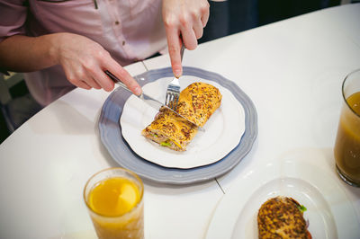 Close-up of man having breakfast