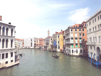 Canal amidst buildings in city