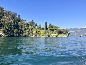 Scenic view of lale como against clear blue sky